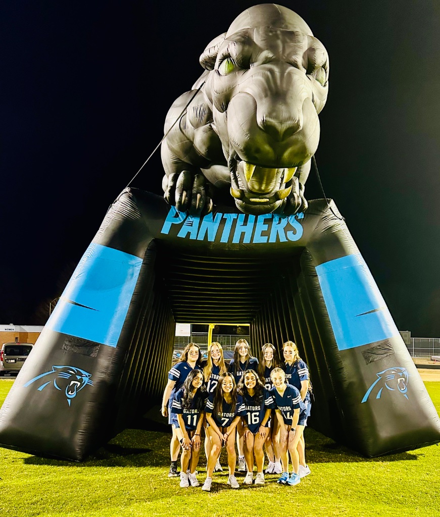 The team posing under the Panthers tunnel before kickoff