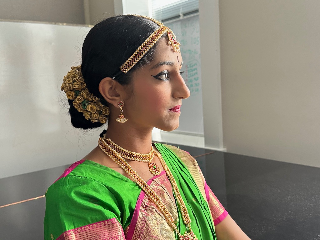 A serene backstage portrait — traditional jewelry and poise