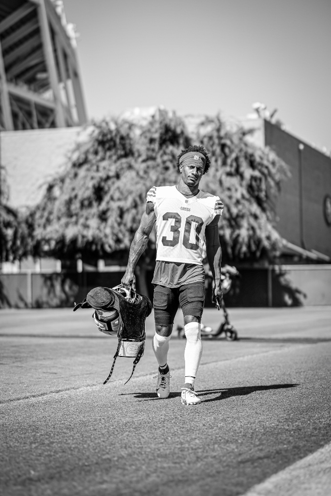 George Odum walking with helmet