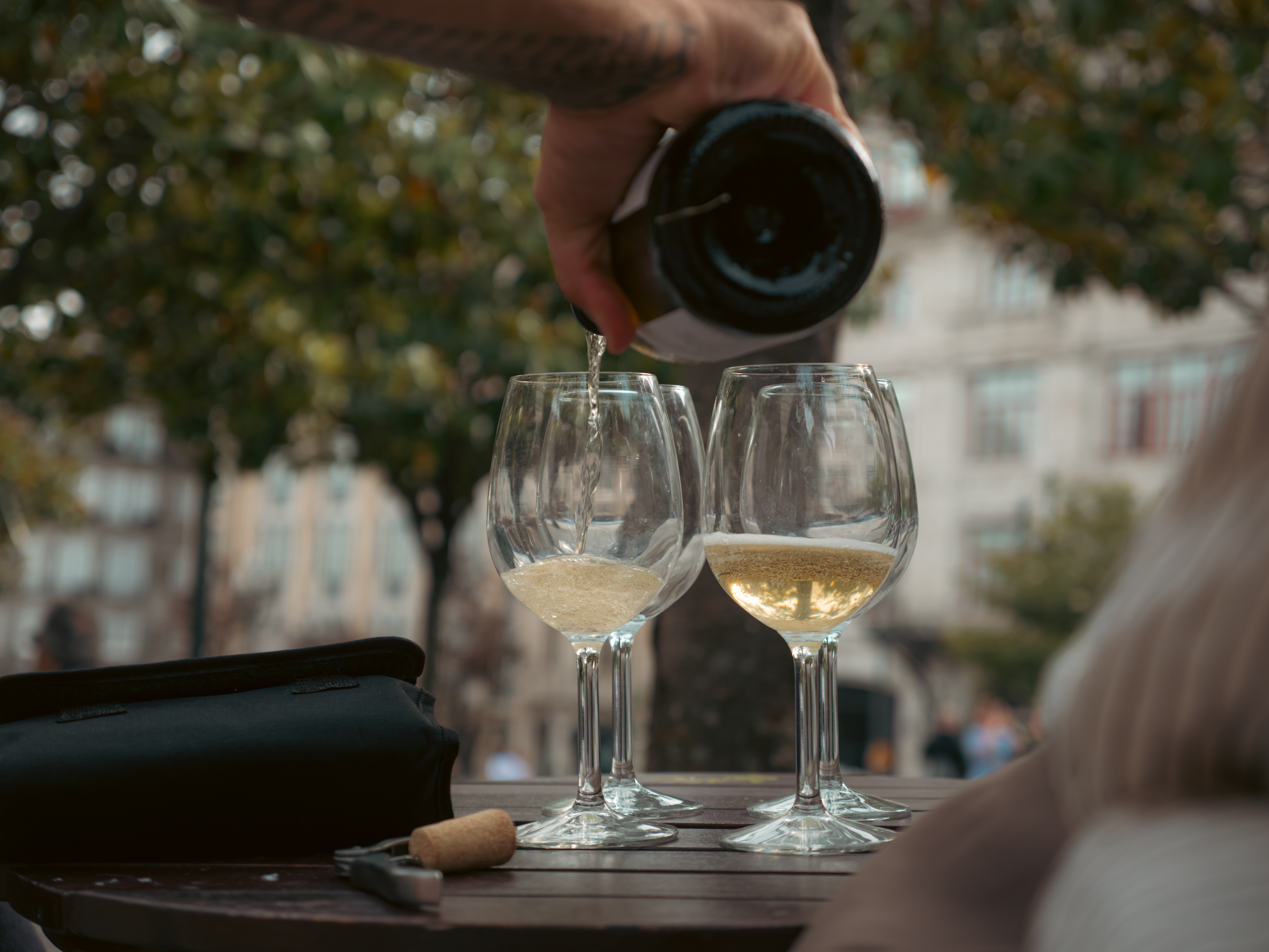 Sharing wine at a table in Portugal
