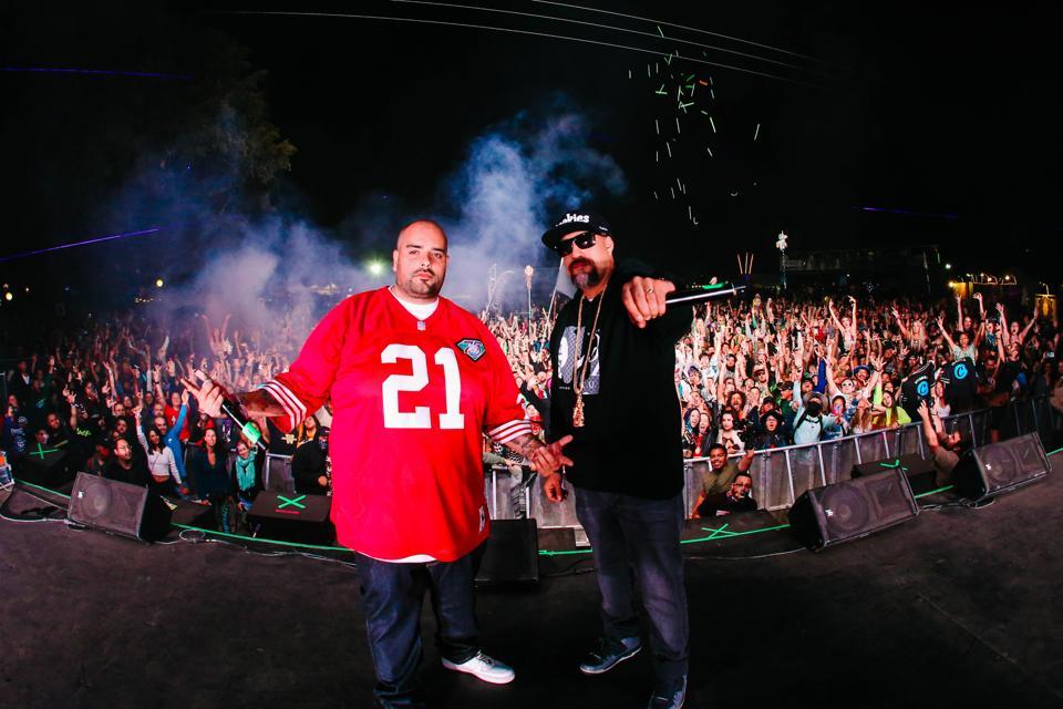 B-Real performing on stage alongside Berner