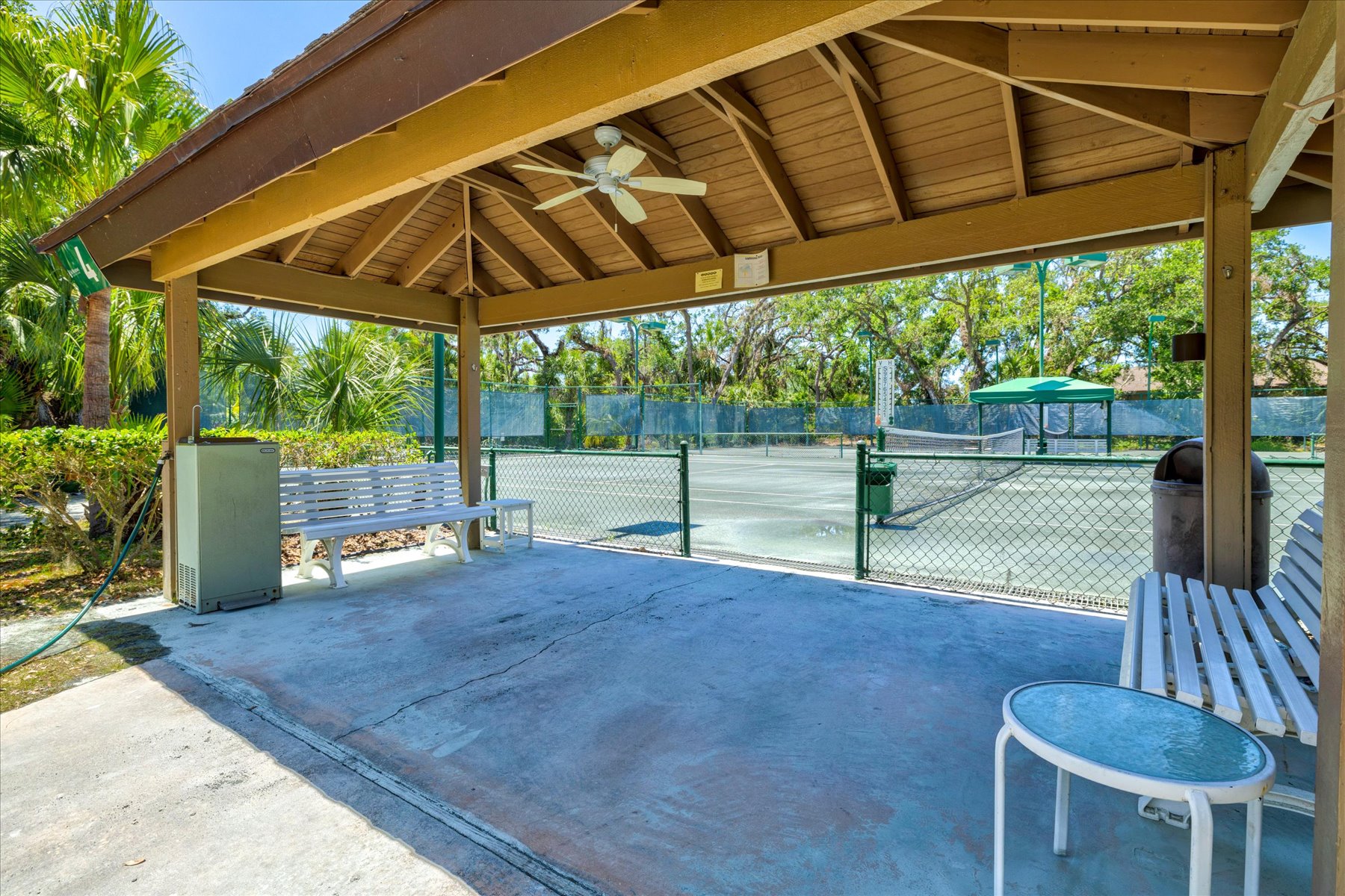 A shaded pavilion overlooking the courts