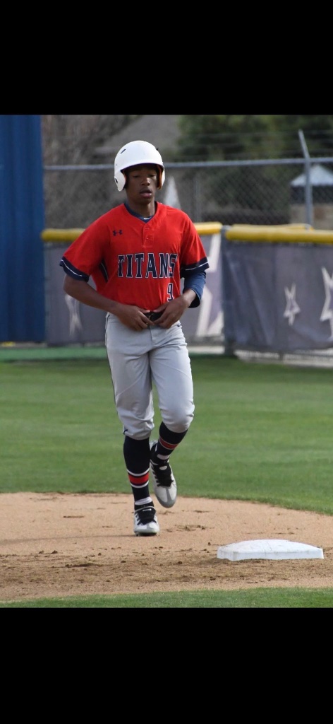 Karmelo Anthony in baseball uniform, running bases