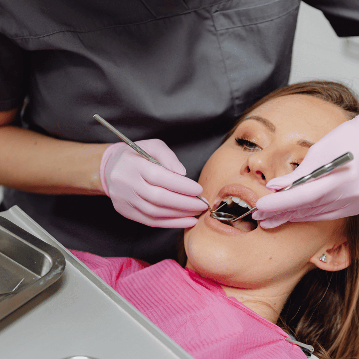 Patient receiving dental implant treatment at clinic