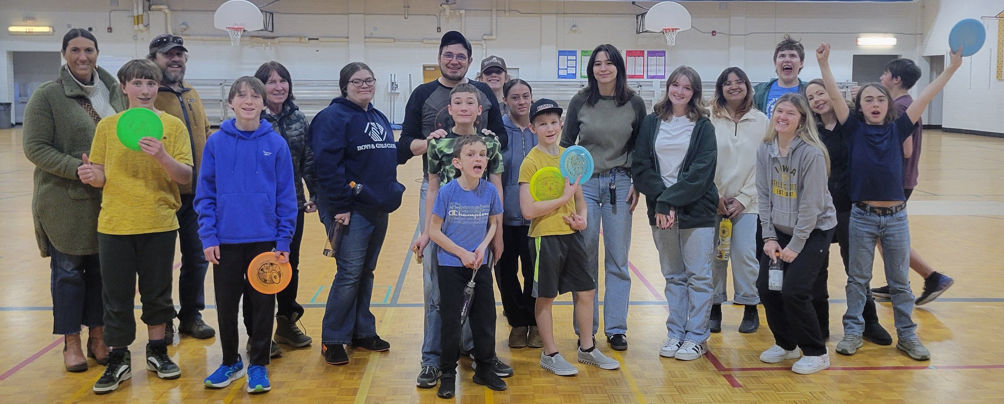 Kids playing disc golf indoors during winter