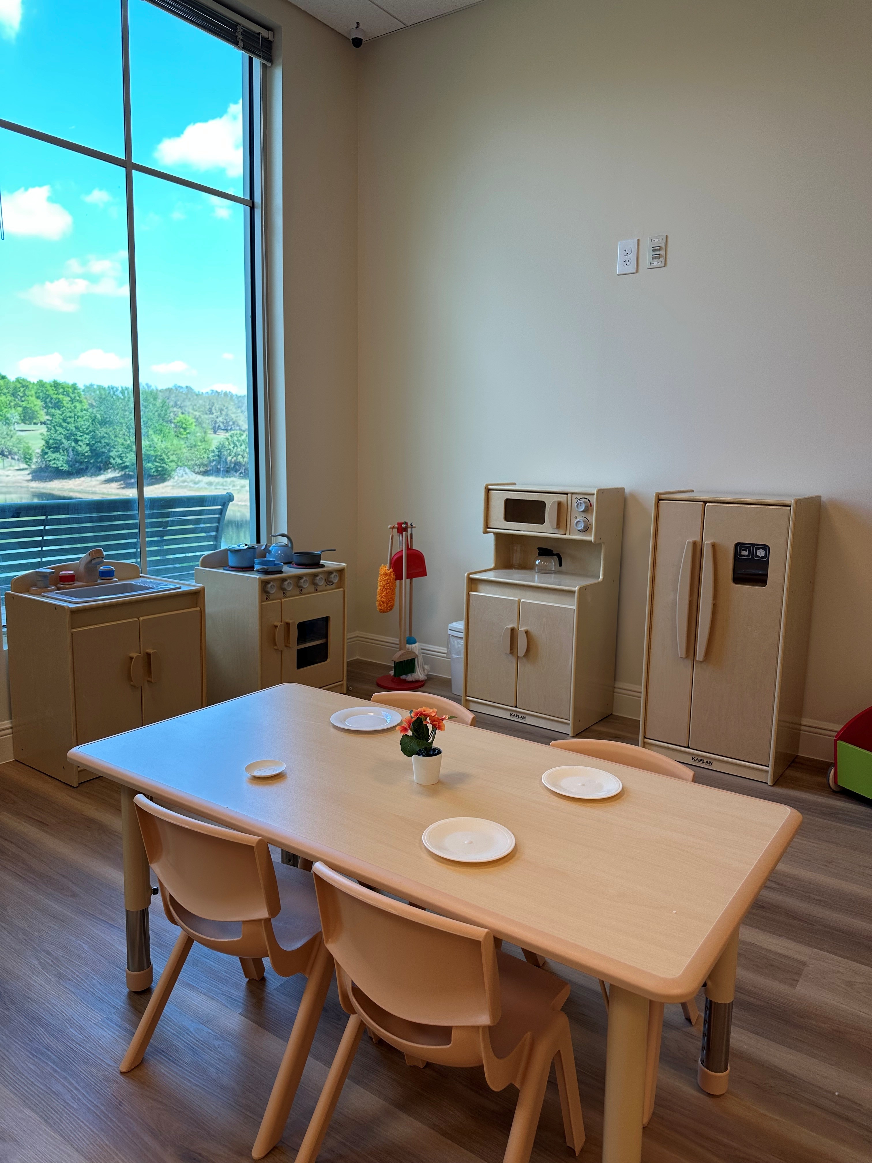The Sunny Days play kitchen and dining area for pretend play.