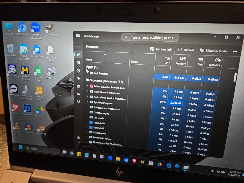 HP Laptop — Task Manager: 1% CPU, 0% Disk