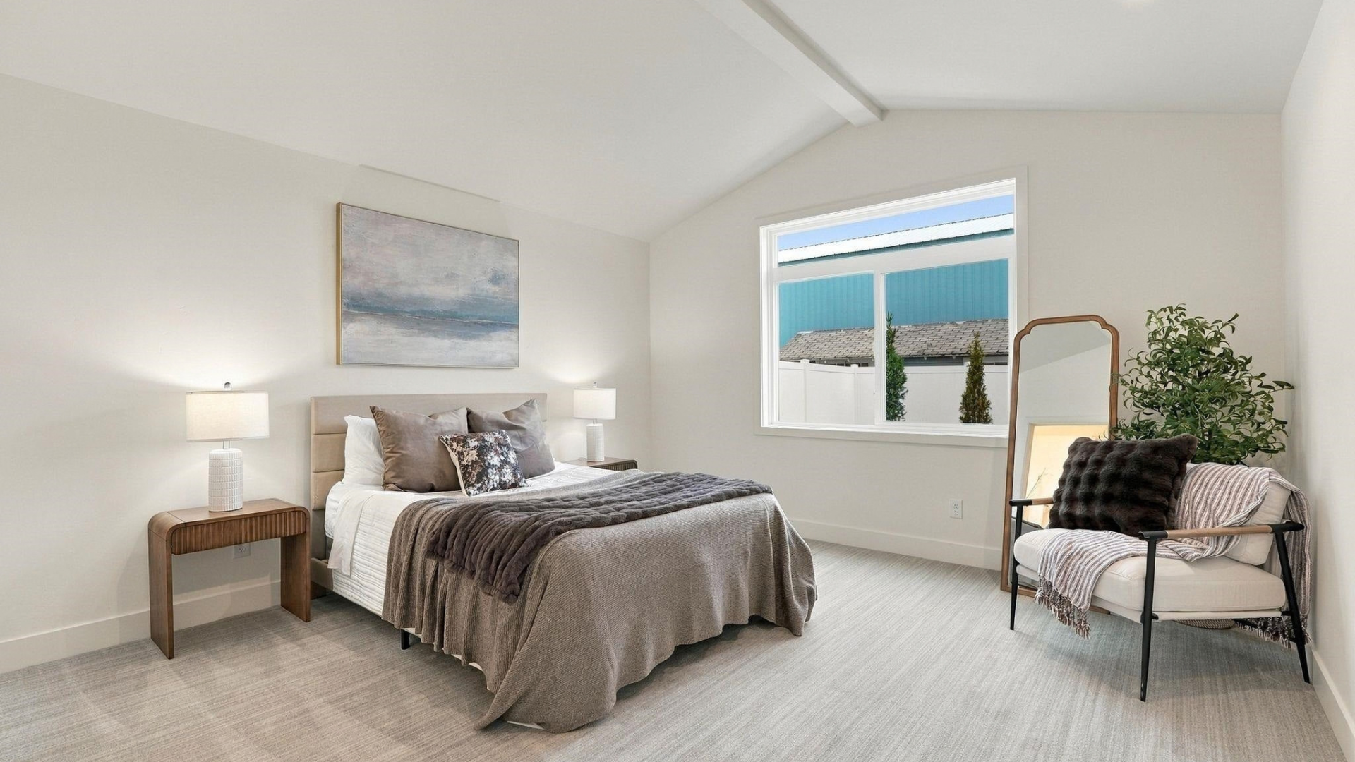 Primary Bedroom — Vaulted Ceiling & Window