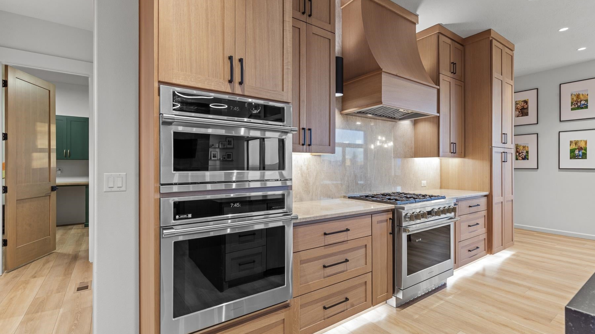 Kitchen — Oak Cabinetry & Stone Backsplash