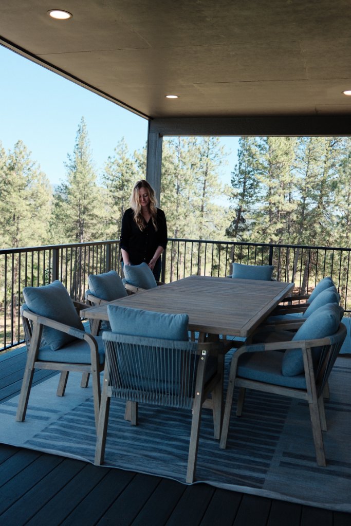 Katie Getman arranging outdoor furniture