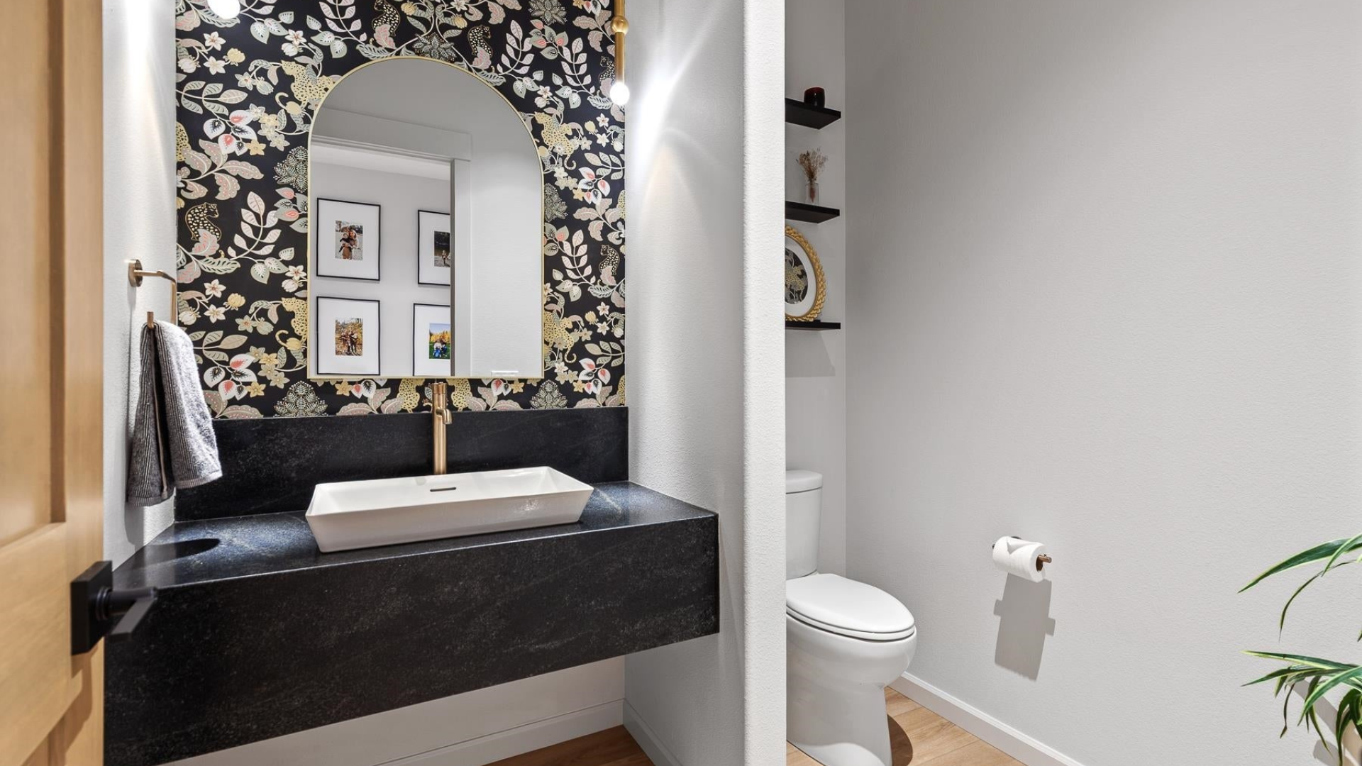 Powder Room — Wallpaper Accent & Gold Fixtures