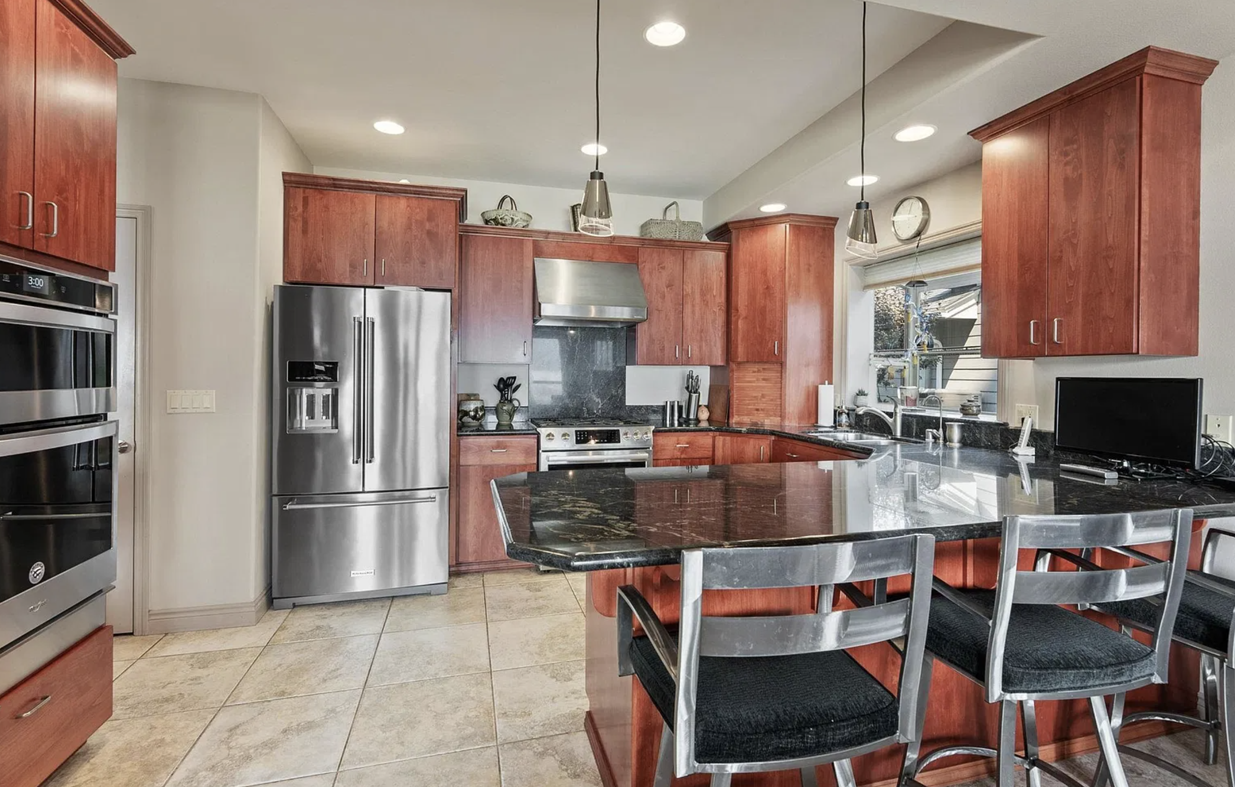 Before — Cherry Cabinetry & Black Granite