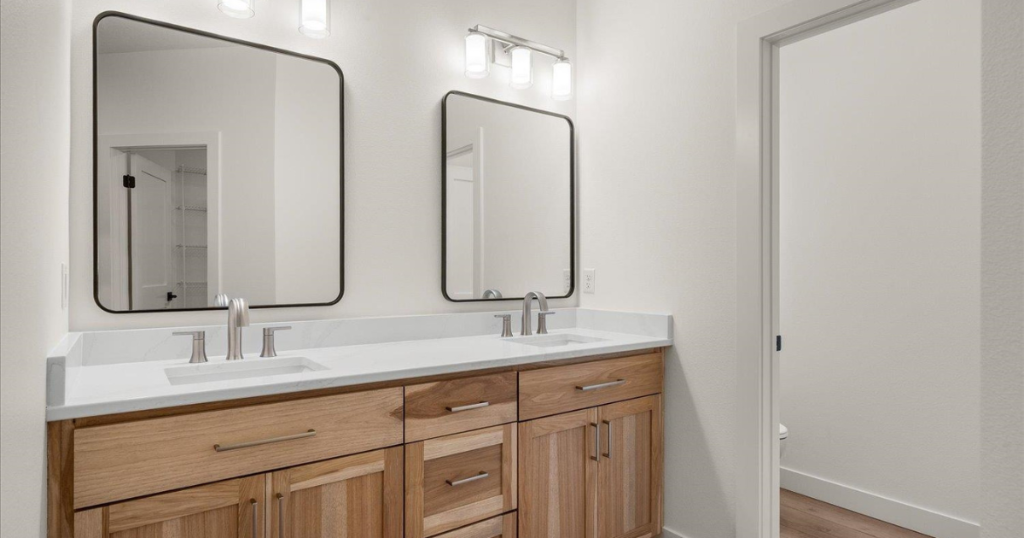Primary Bath — Dual Vanity with Wood Cabinetry