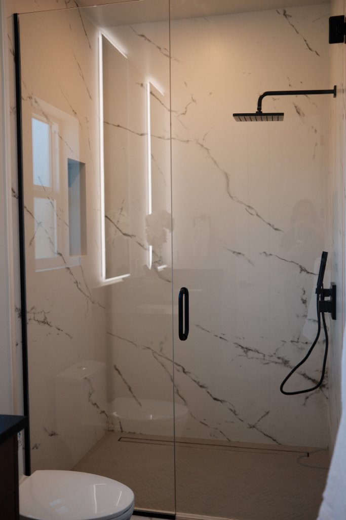 Master Bath — Marble Shower with Black Fixtures