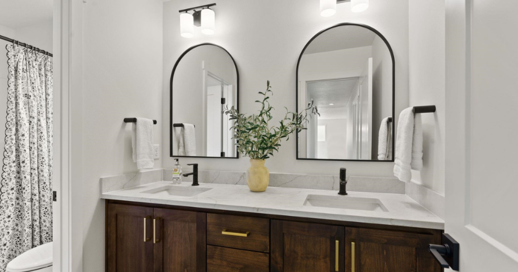 Secondary Bath — Arch Mirrors & Gold Hardware