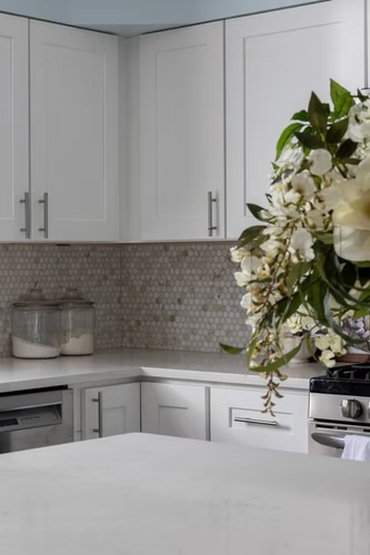 Kitchen — White Cabinetry & Penny Tile Backsplash