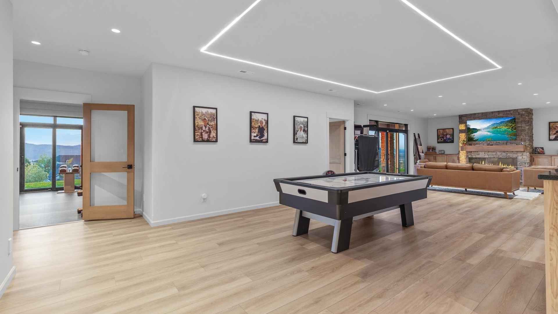 Basement Living — Stone Fireplace & Air Hockey