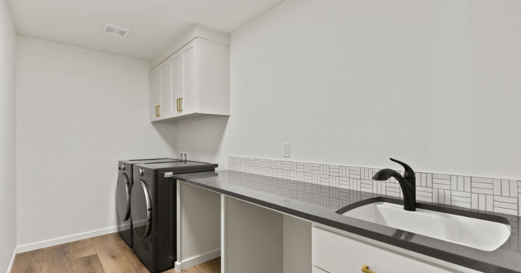 Laundry Room — White Cabinetry & Tile Backsplash