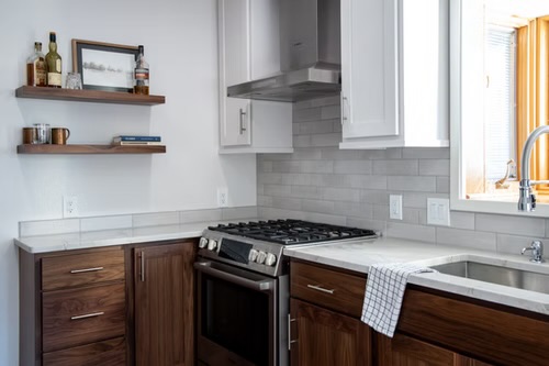 Kitchen — Walnut Cabinetry & Open Shelving