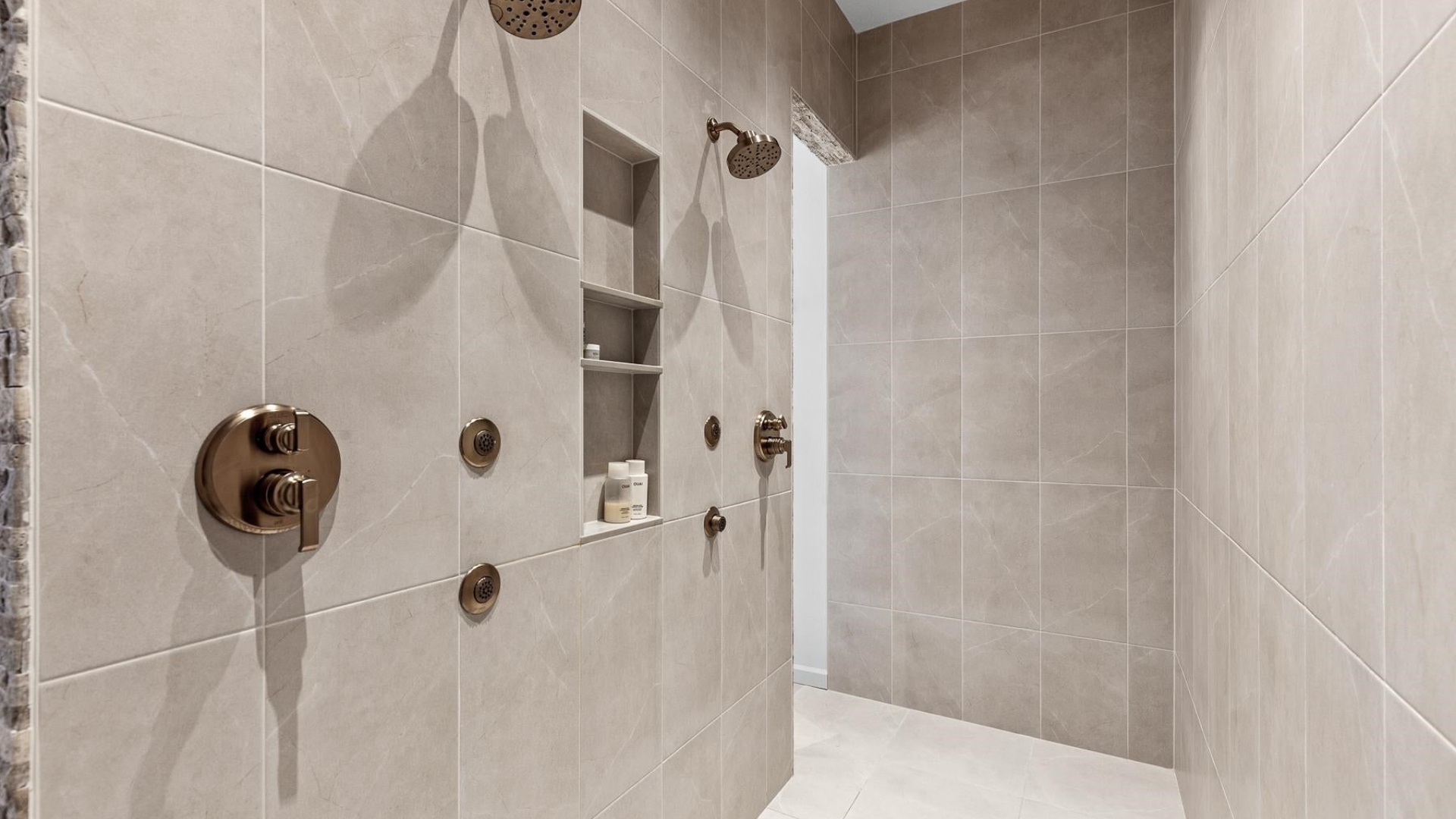 Primary Shower — Marble Tile & Bronze Fixtures