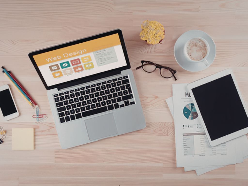 Laptop and devices on desk