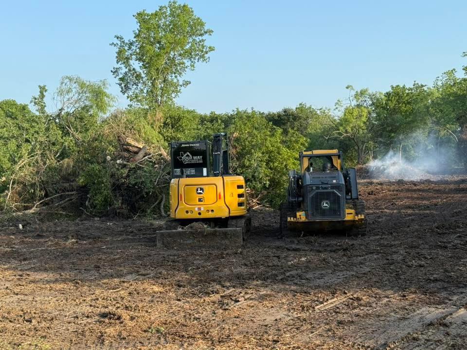 Your Way Land Clearing LLC excavator clearing trees and brush near Cedar Creek Lake Texas