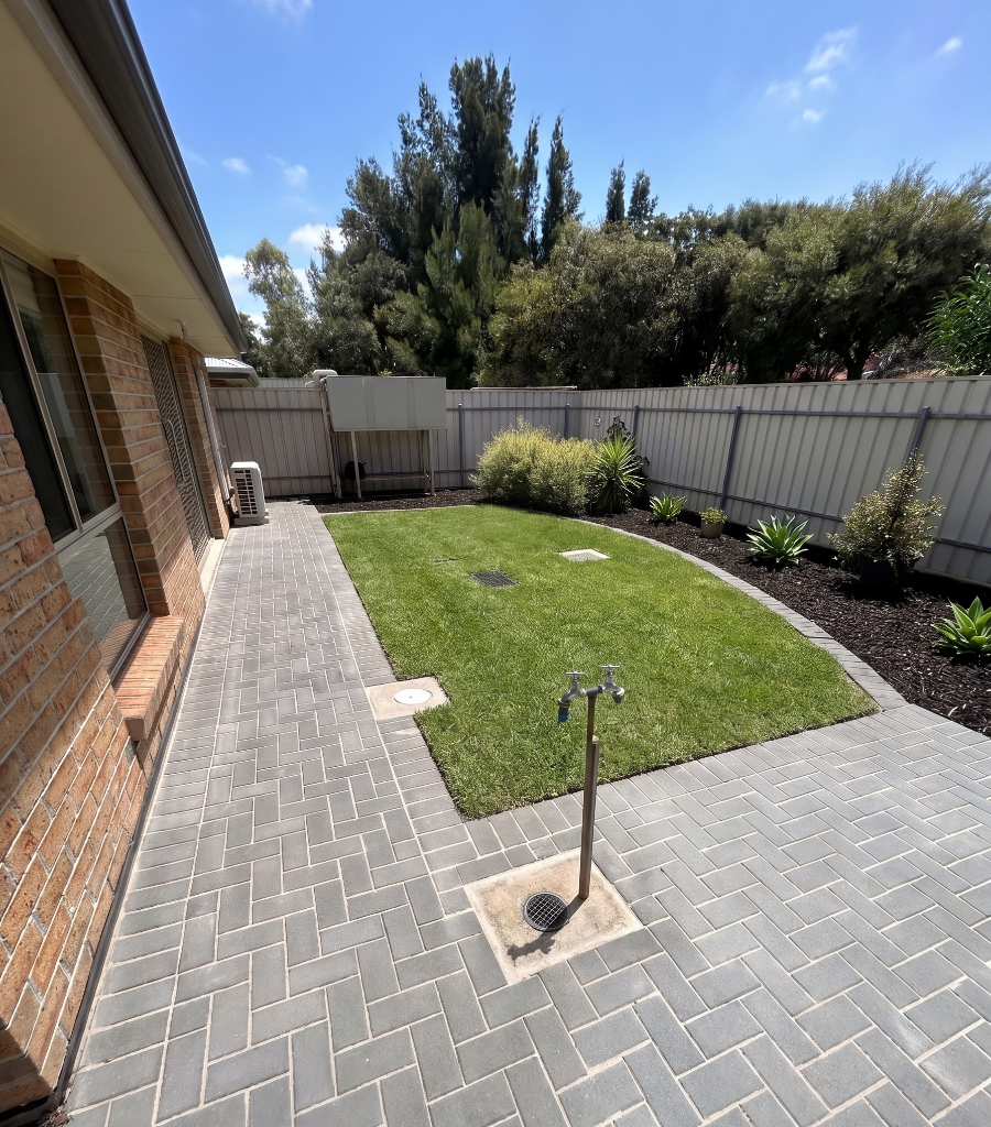 House surround — charcoal bricks laid in a herringbone pattern