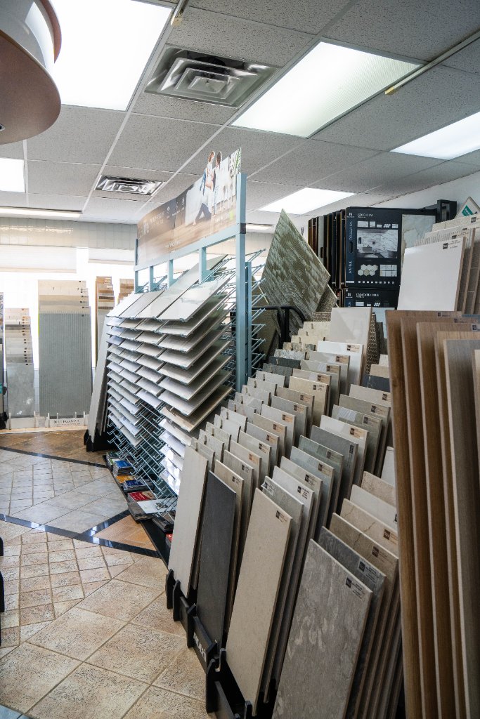 Wide aisle of tile display racks