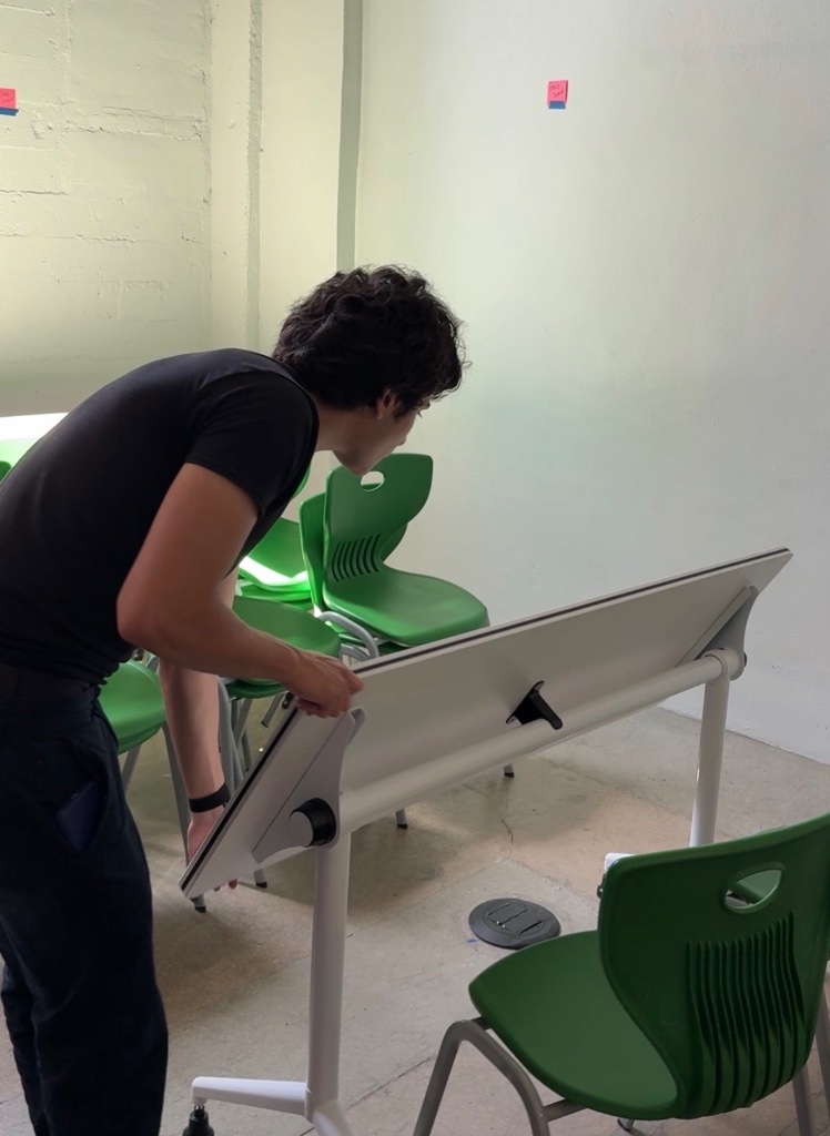 Adjusting a classroom desk