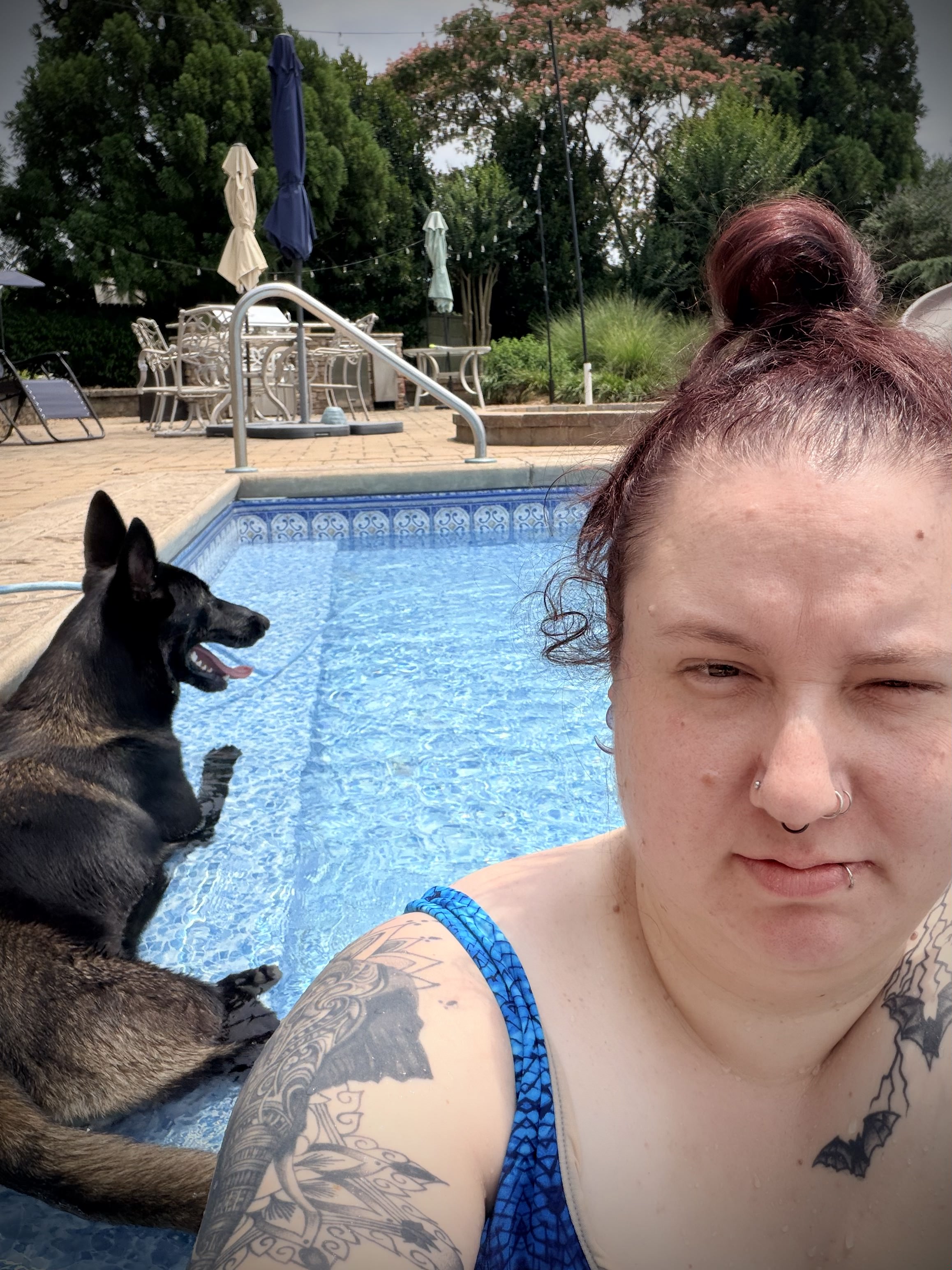 Brittney with her pup by the pool