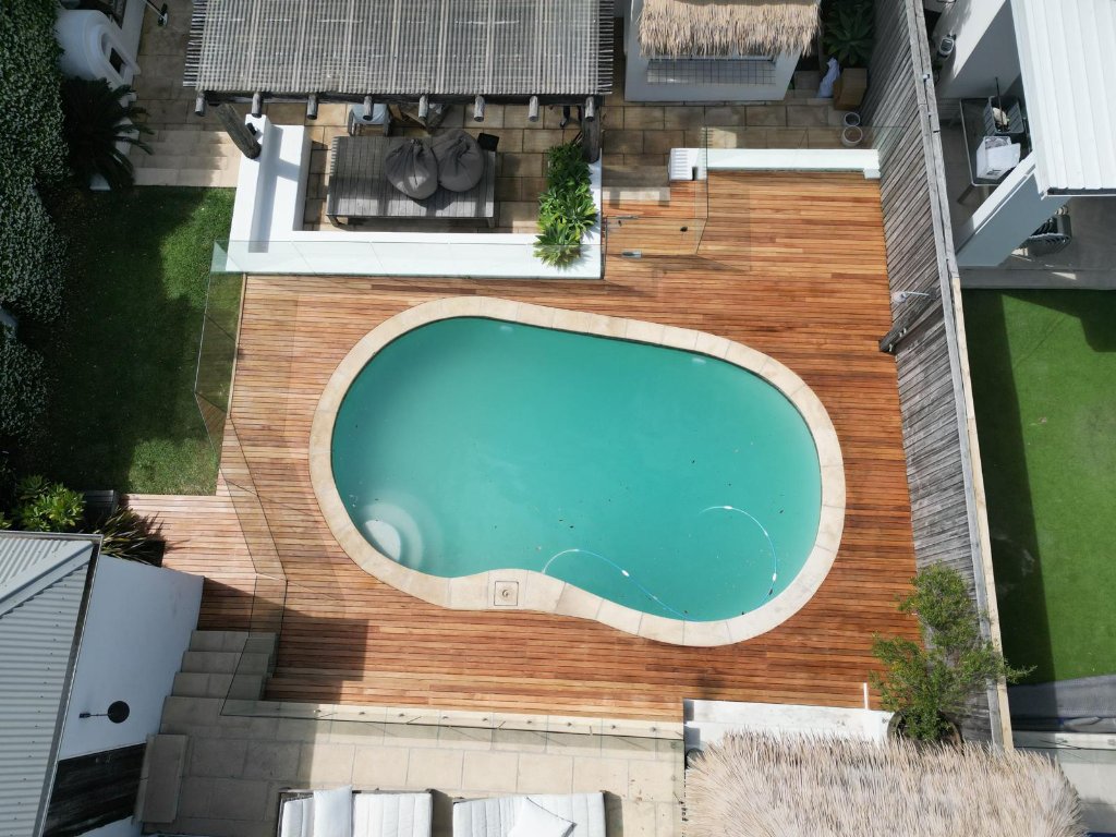 Blackbutt pool deck Sydney - second aerial angle showing board direction and glass pool fence