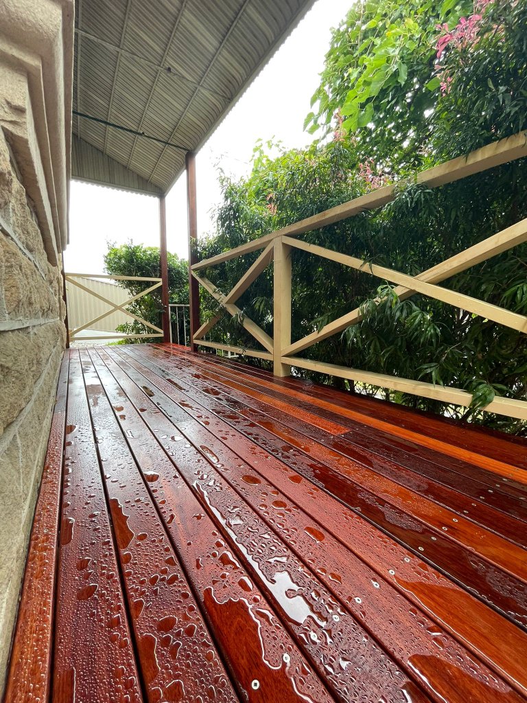 Jarrah hardwood deck with water beading after rain Inner West Sydney