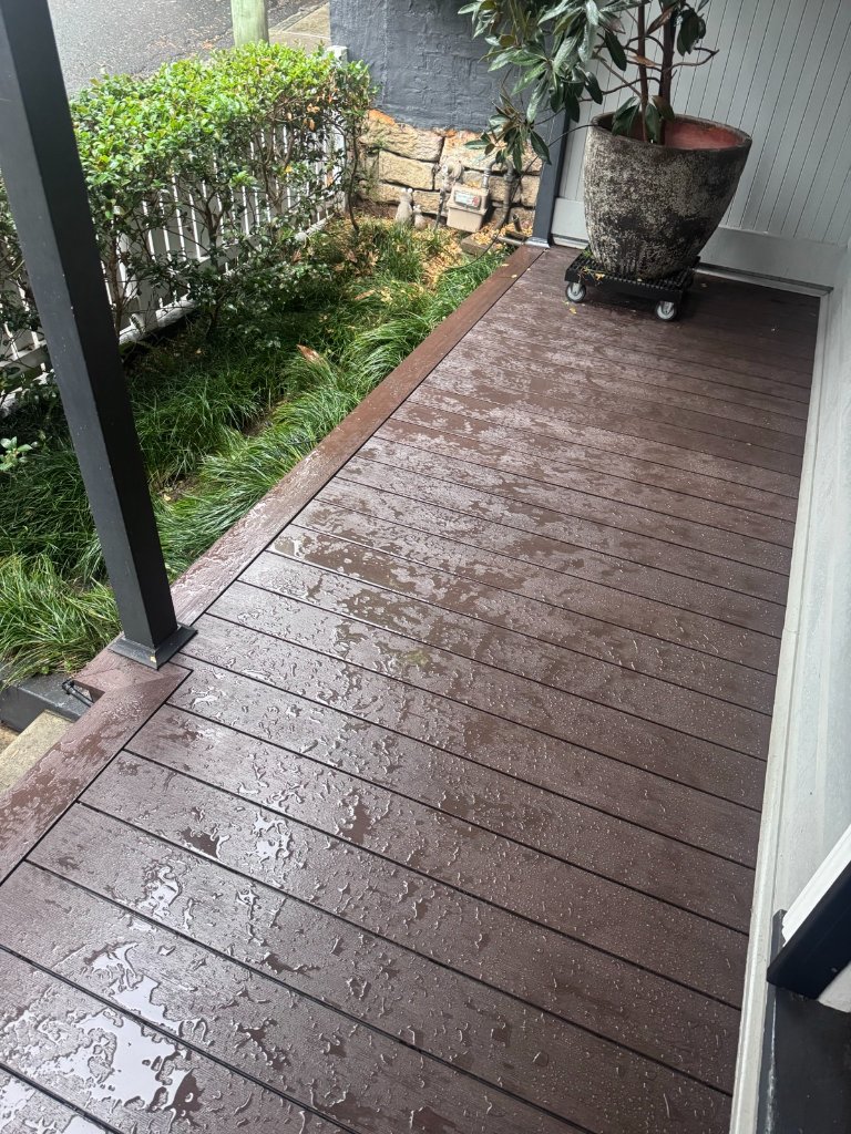 WPC composite decking in Deep Mahogany wet in the rain Sydney