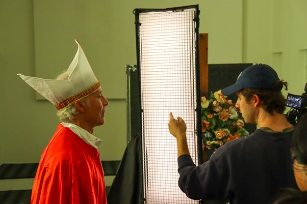 Behind the scenes - lighting setup with bishop in vestments