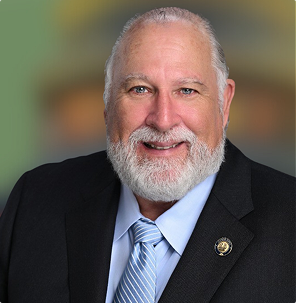 Senator Michael "Big Mike" Fèsi