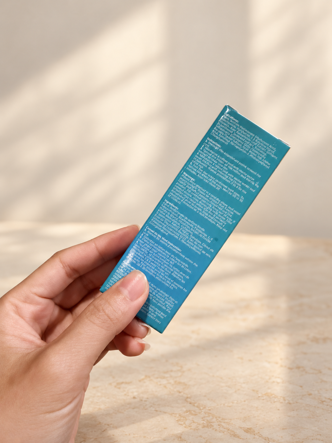 Eye Essence Cream ingredients held by hand
