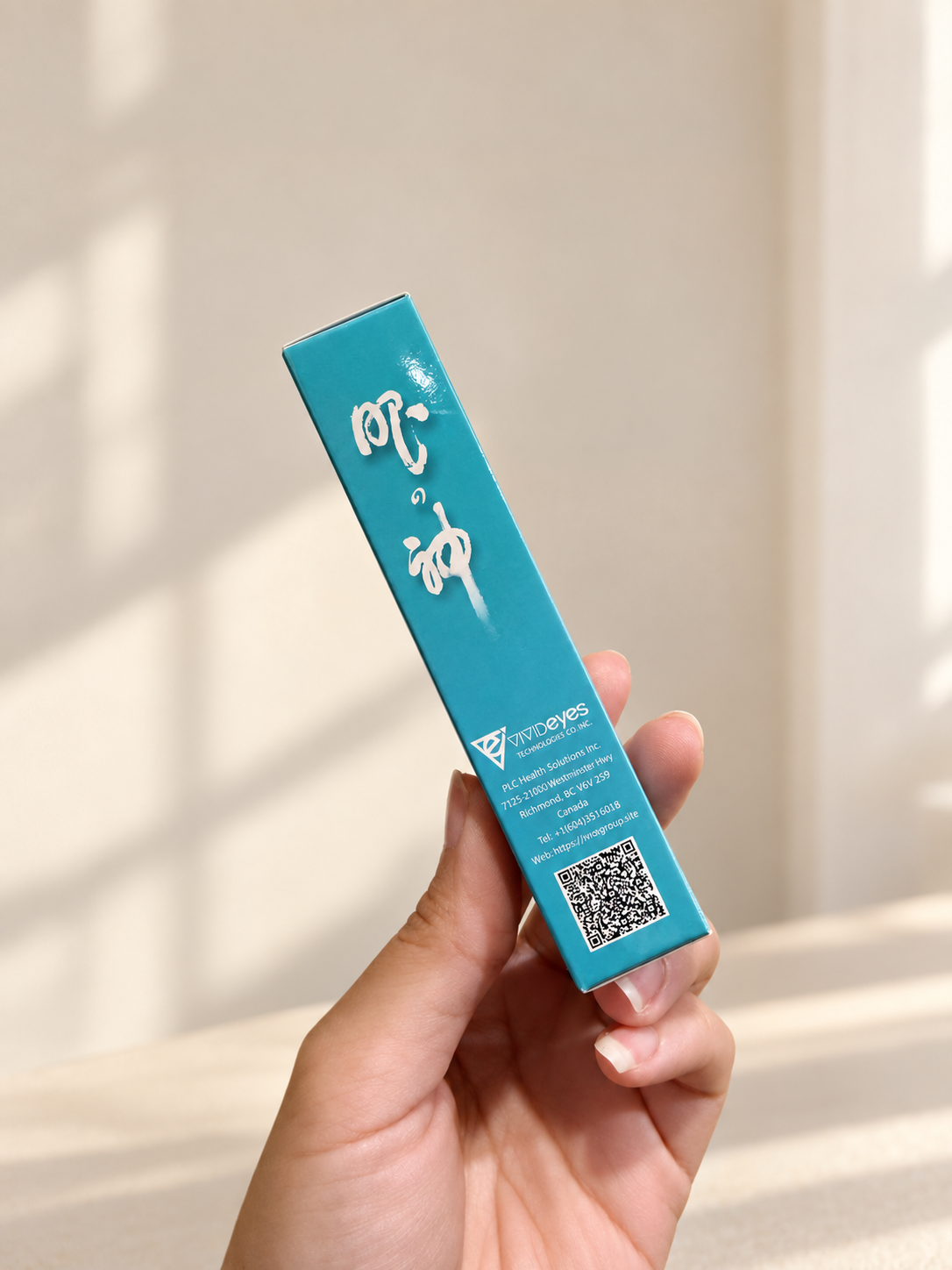 Eye Essence Cream box side held by hand