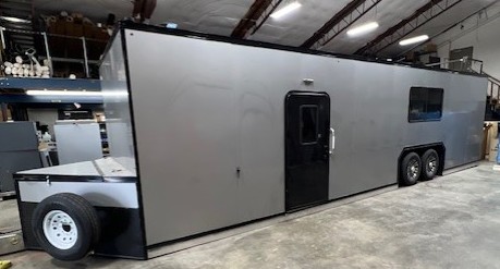 Toy hauler with ramp door open