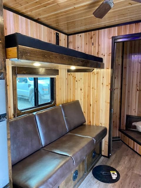 Leather sofa with overhead bunk