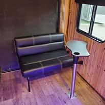 Navy blue trailer exterior in shop