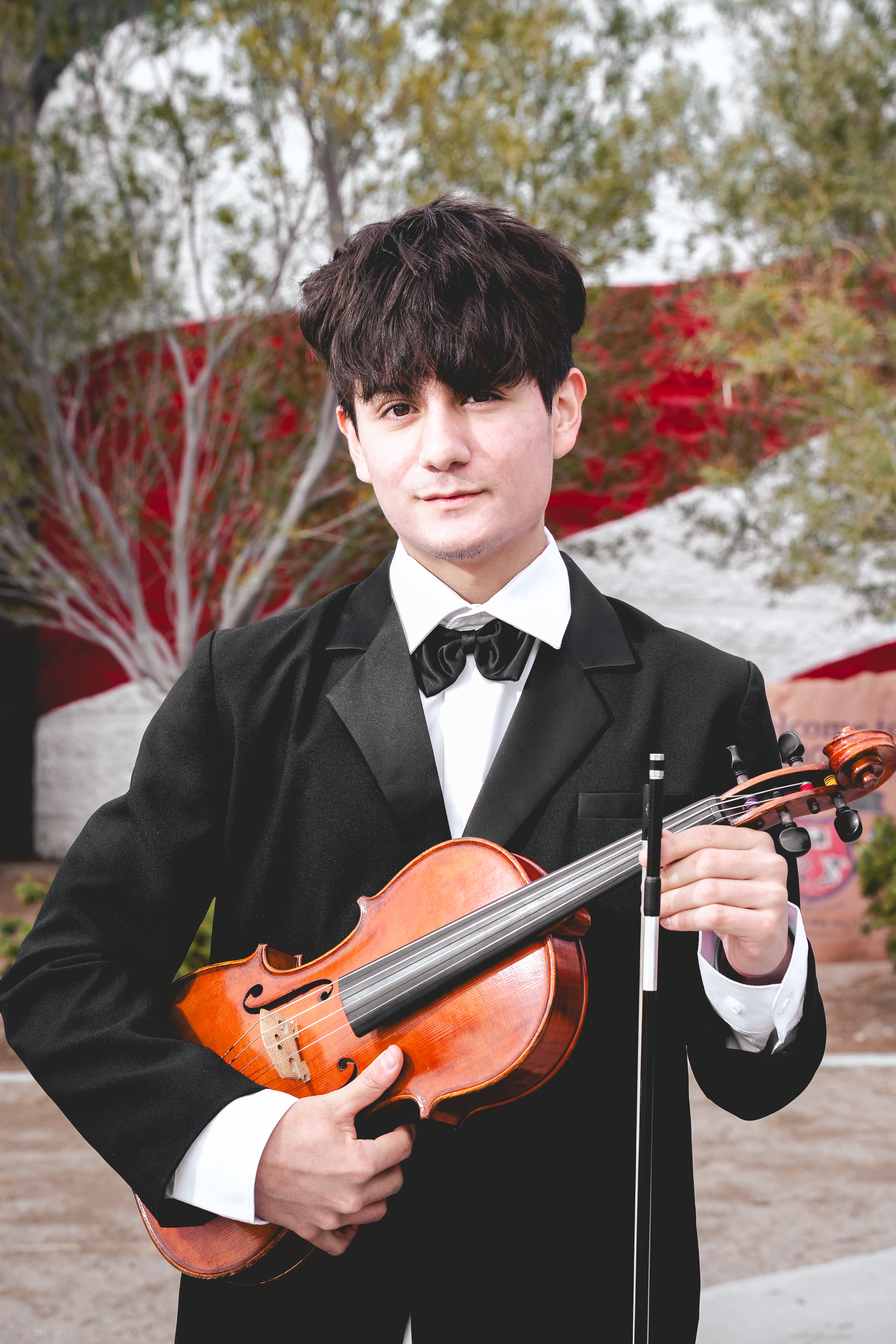 Senior portrait with violin and bowtie