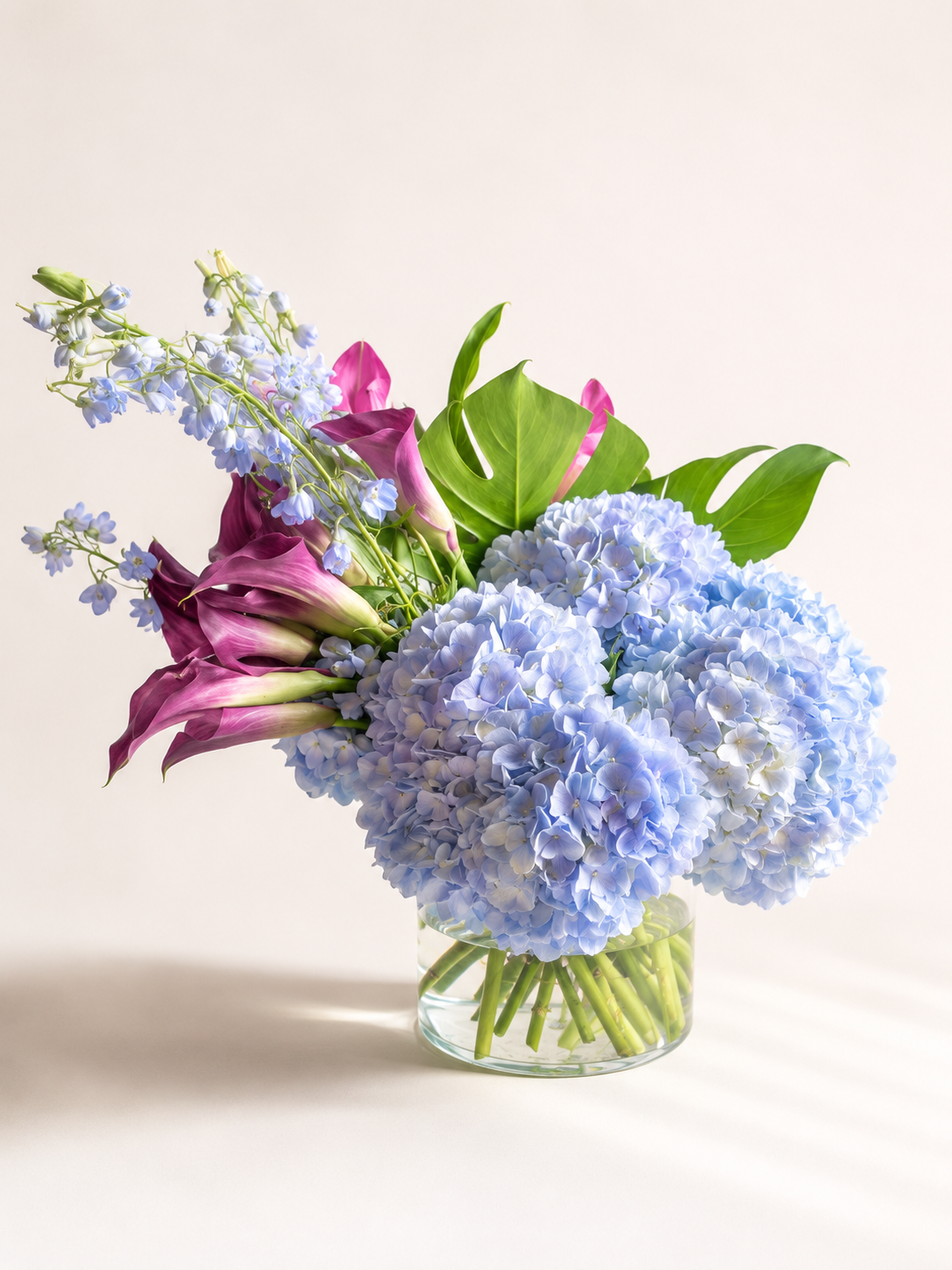 standard: Burgundy & Blue Calla Lily & Hydrangea Arrangement — burgundy just because luxury flower arrangement delivered same-day in Las Vegas NV | Bud Weismiller Flowers