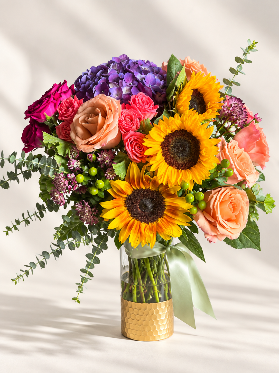 standard: Cheerful yellow and orange custom get-well floral arrangement for delivery to hospitals or homes across Las Vegas, NV.