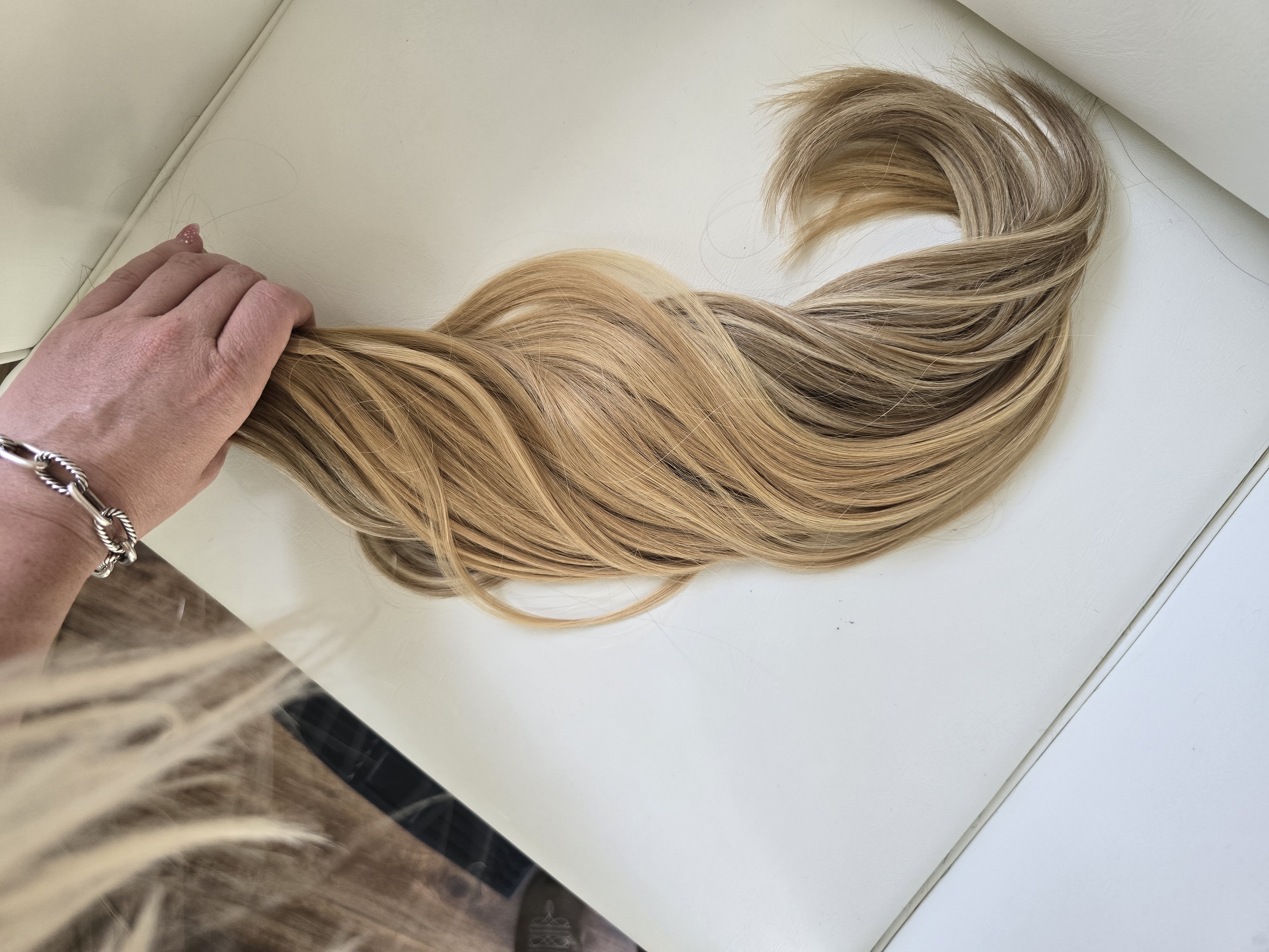 Highlighted K-tip extension bundle held to show color blend Boca Raton