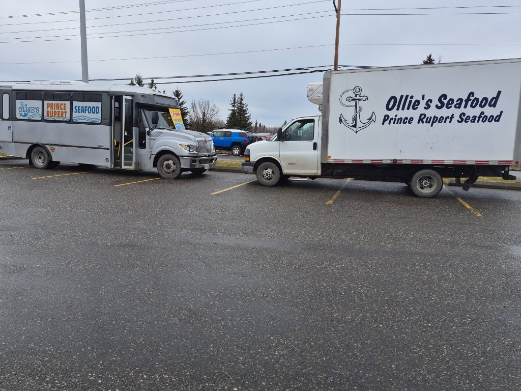 The official Ollie's bus and GMC reefer van side by side