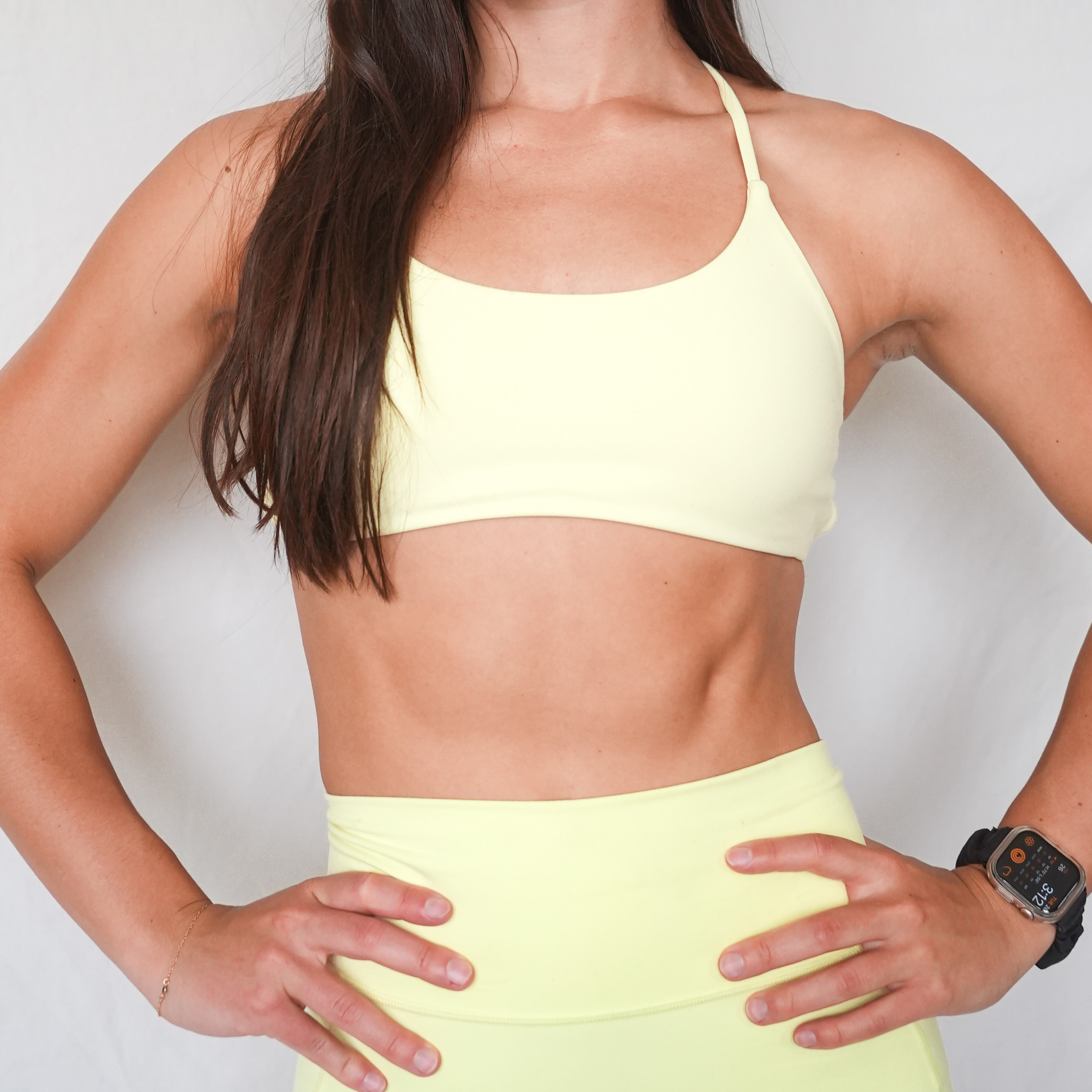 Client in training attire, hands on hips