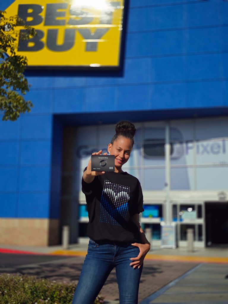 Consumer holding Tangem Ring outside Best Buy