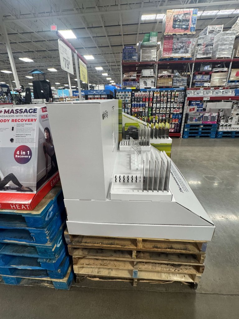 Pallet displays in warehouse store — AirTag and massage products
