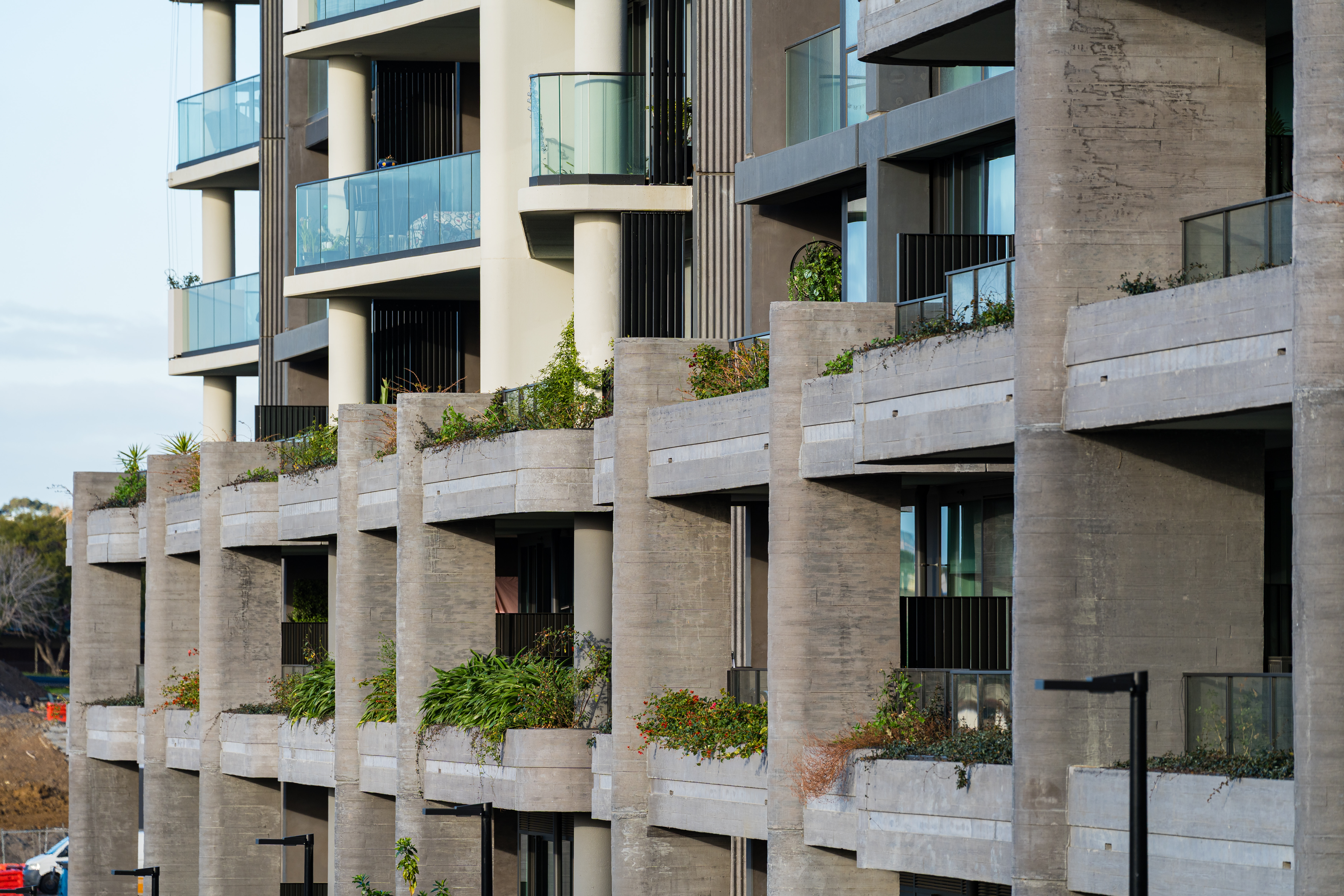 Modern apartment building with balcony greenery