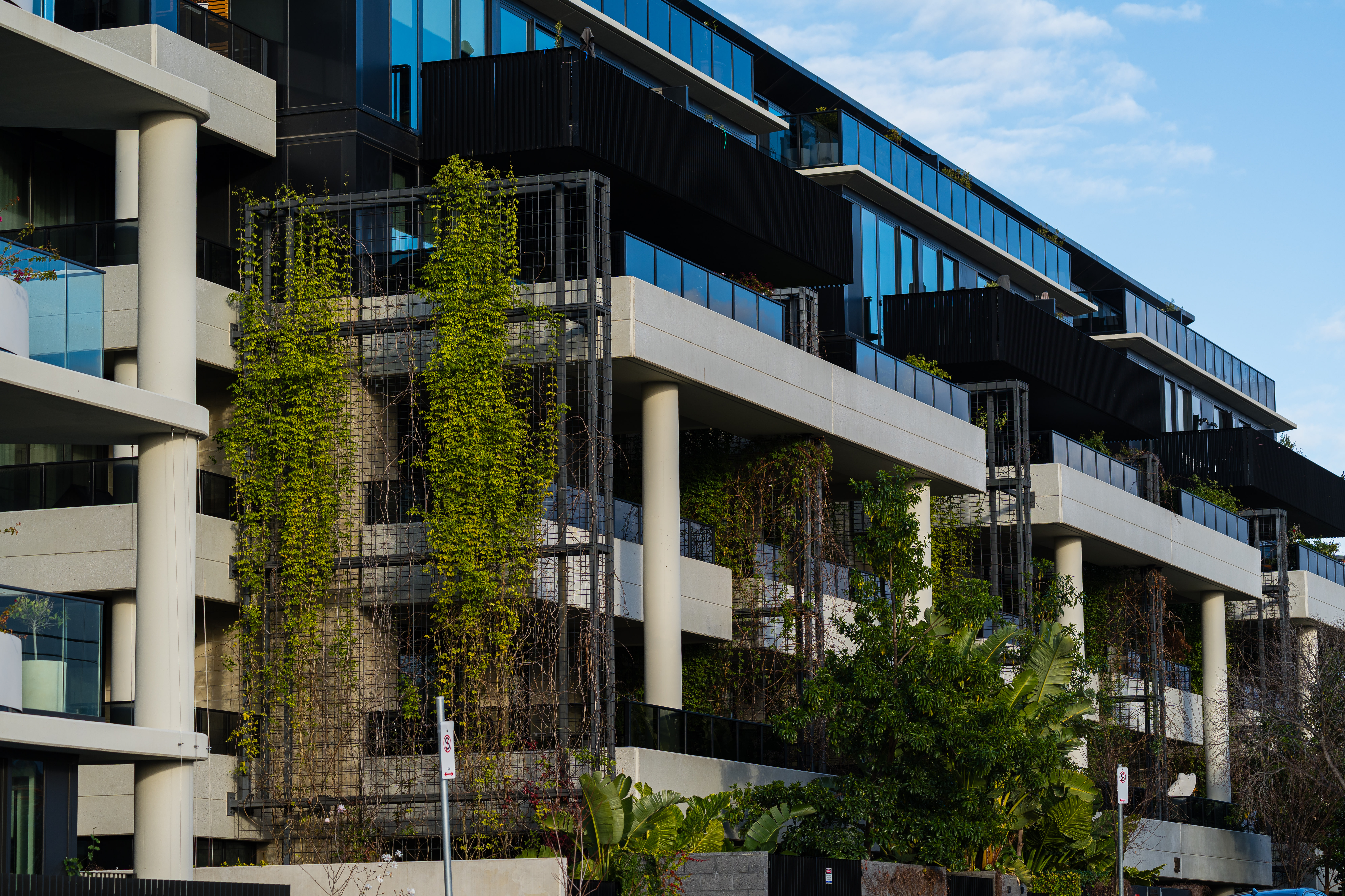 Modern residential building with integrated greenery and landscaping